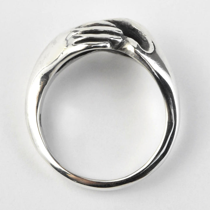 Hands Holding Sterling Silver Ring - Goldmakers Fine Jewelry