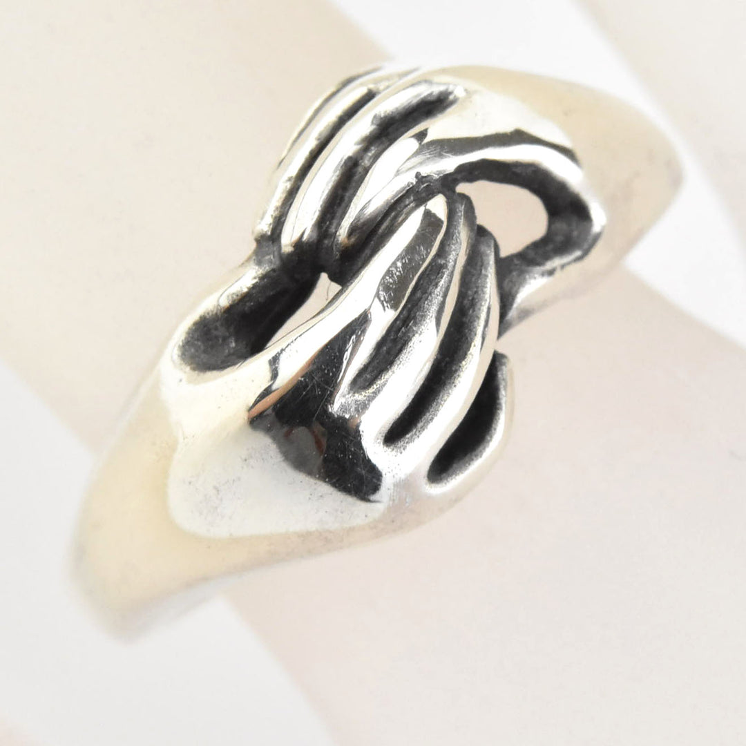 Hands Holding Sterling Silver Ring - Goldmakers Fine Jewelry