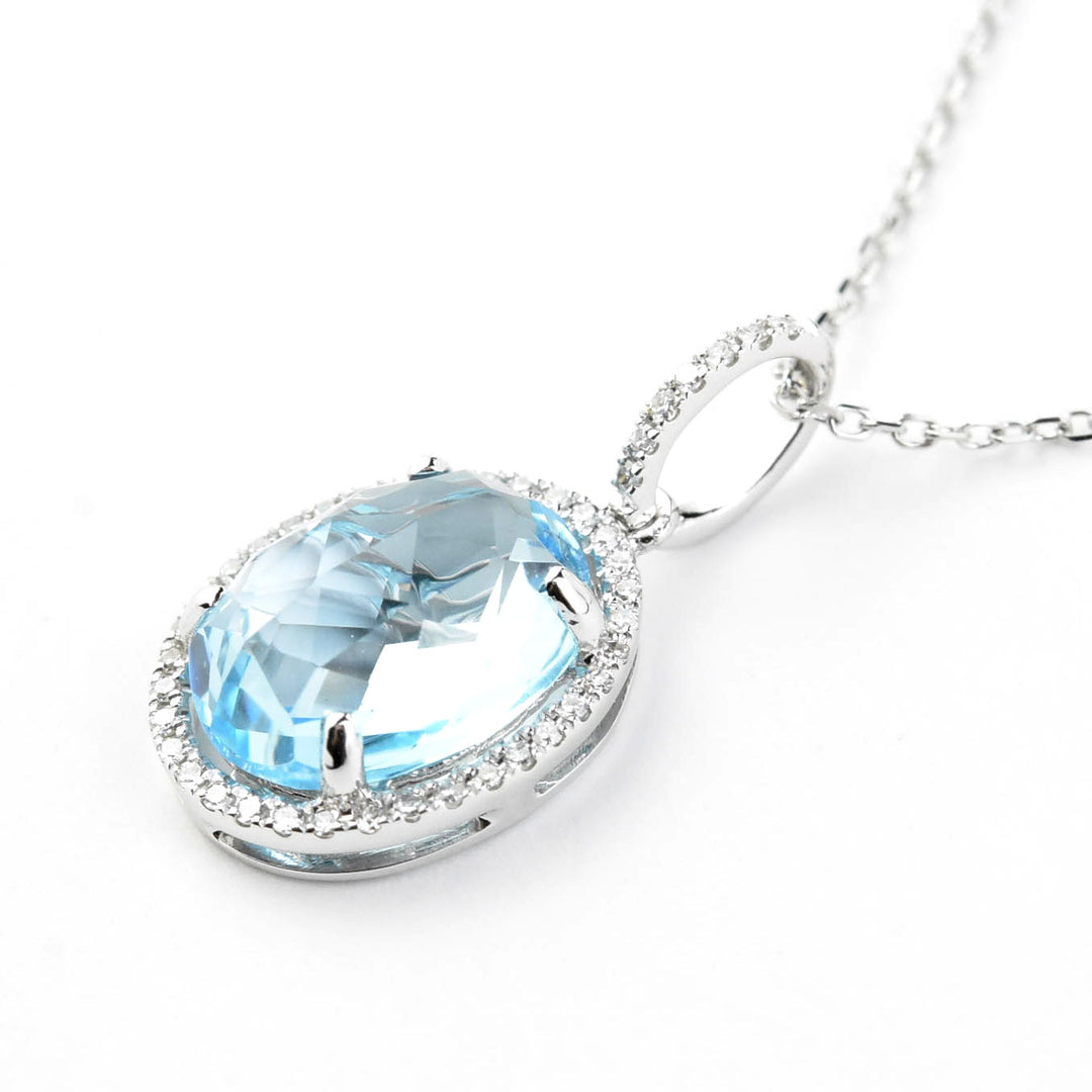 Blue Topaz and Diamond Halo Necklace in 14k White Gold