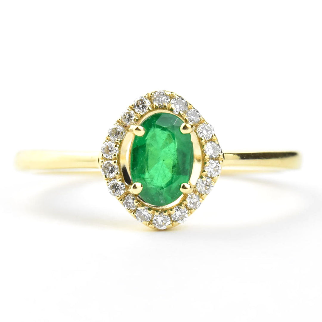 Emerald and Diamond Halo Ring in 18k Yellow Gold