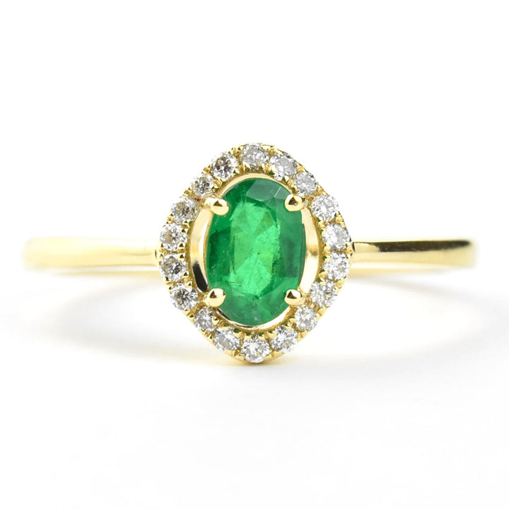 Emerald and Diamond Halo Ring in 18k Yellow Gold