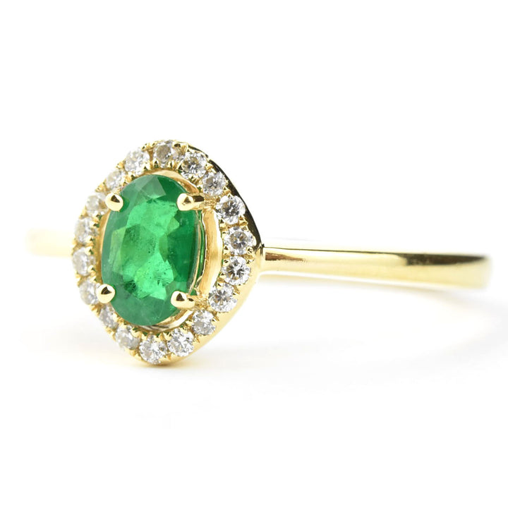 Emerald and Diamond Halo Ring in 18k Yellow Gold
