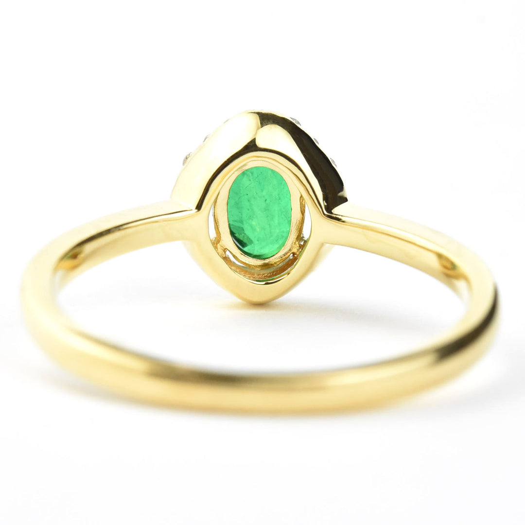 Emerald and Diamond Halo Ring in 18k Yellow Gold