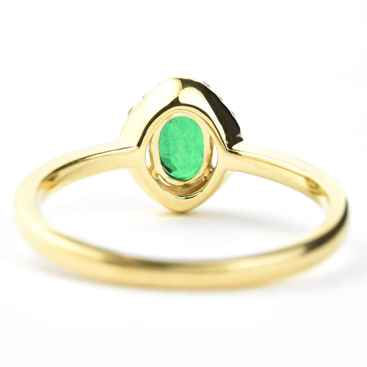 Emerald and Diamond Halo Ring in 18k Yellow Gold