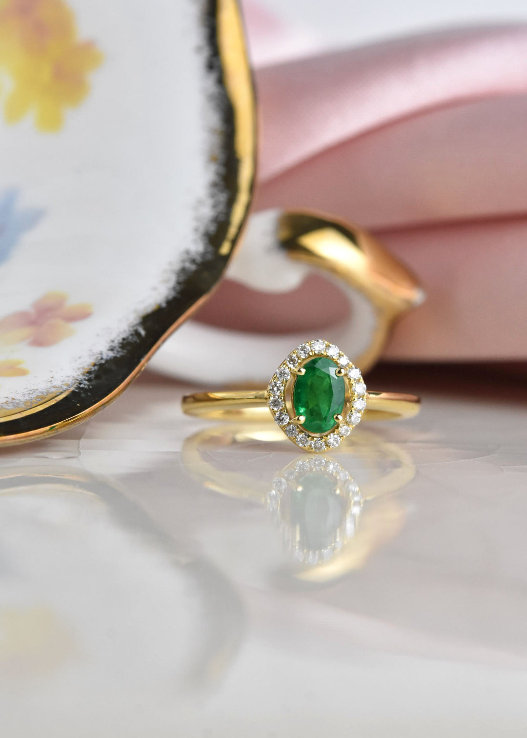 Emerald and Diamond Halo Ring in 18k Yellow Gold