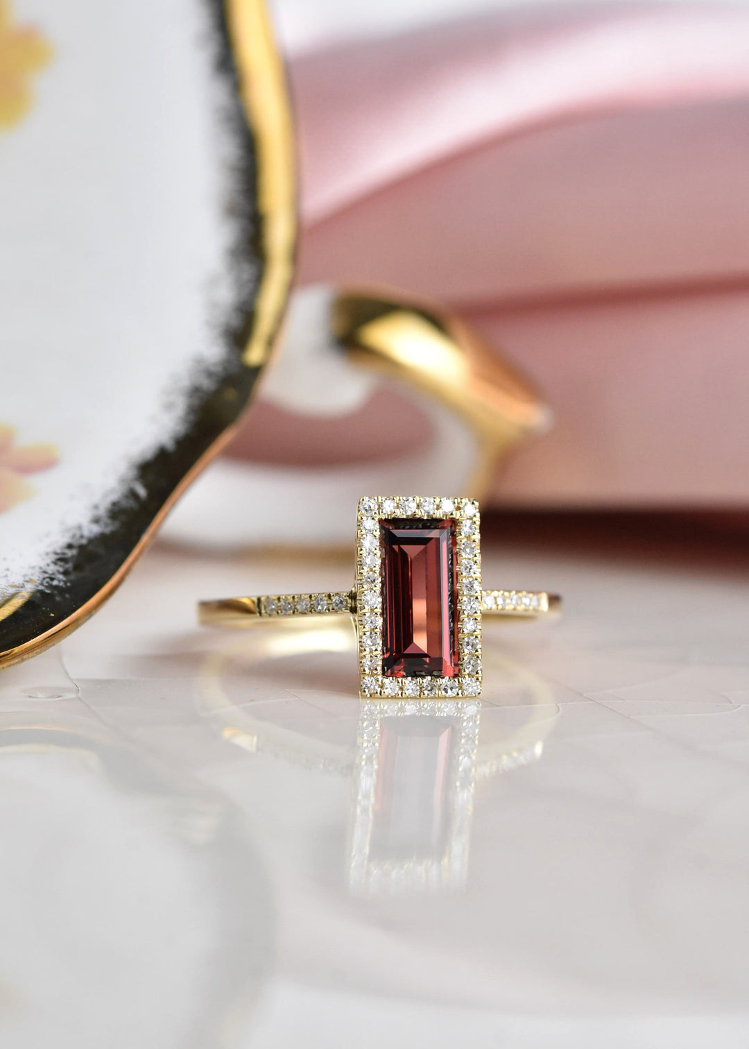 Garnet and Diamond Halo Ring in Yellow Gold