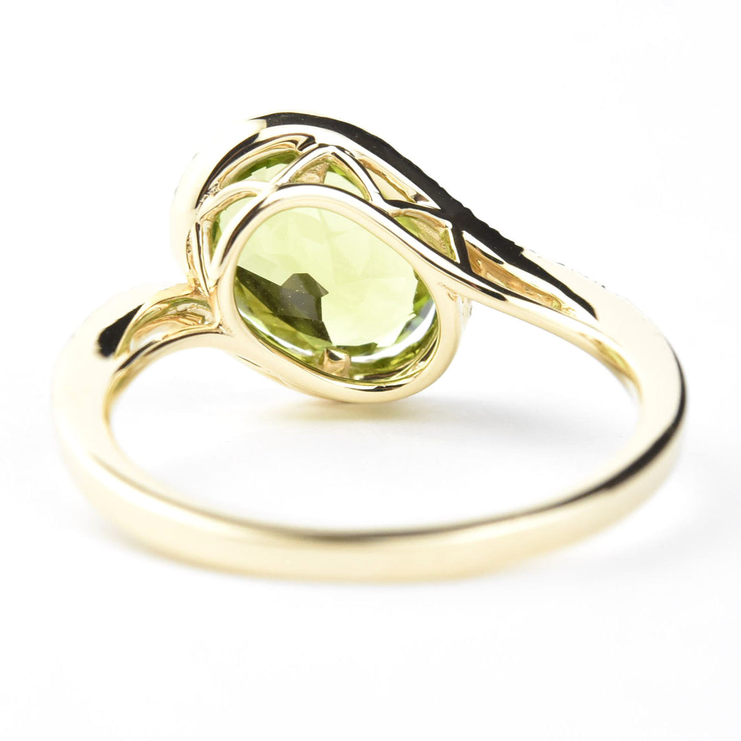 Peridot and Diamond Bypass Ring in 14k Yellow Gold
