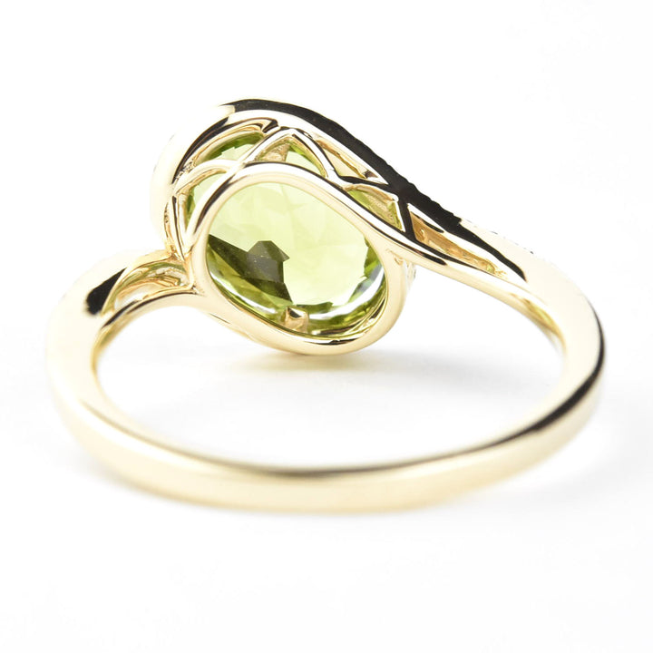 Peridot and Diamond Bypass Ring in 14k Yellow Gold