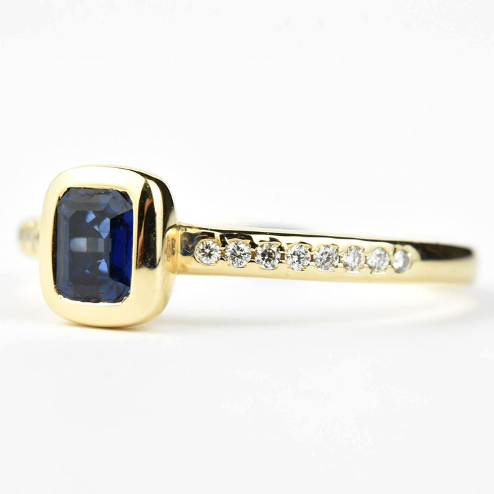 Bezel Set Blue Sapphire and Diamond Solitaire