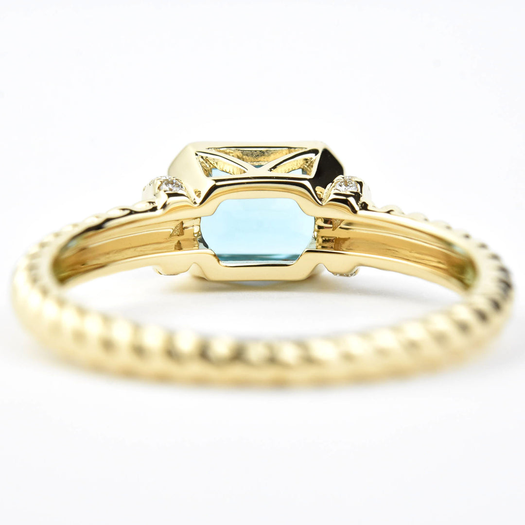 East-West Blue Topaz and Diamond Ring