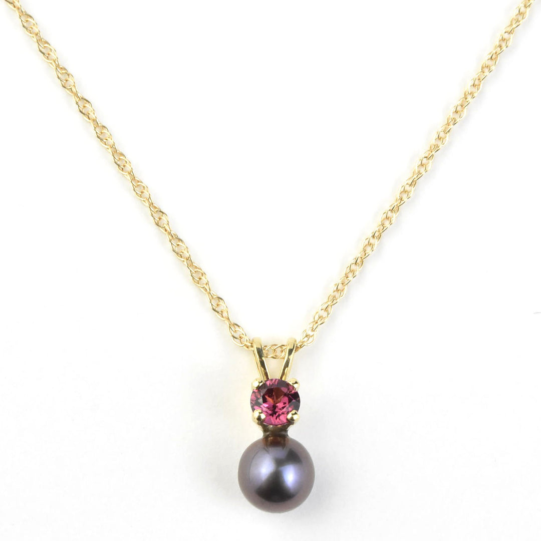 Fine Black Pearl and Garnet Pendant Necklace in Yellow Gold