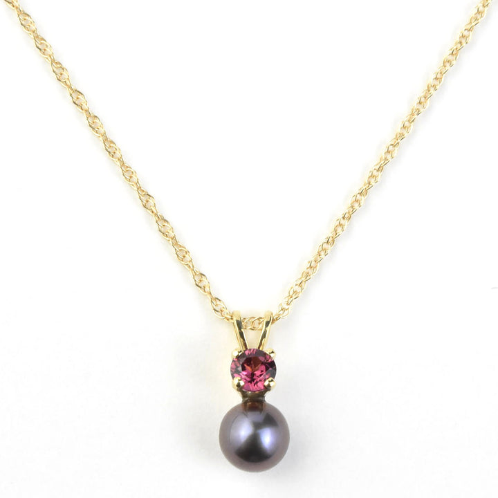 Fine Black Pearl and Garnet Pendant Necklace in Yellow Gold