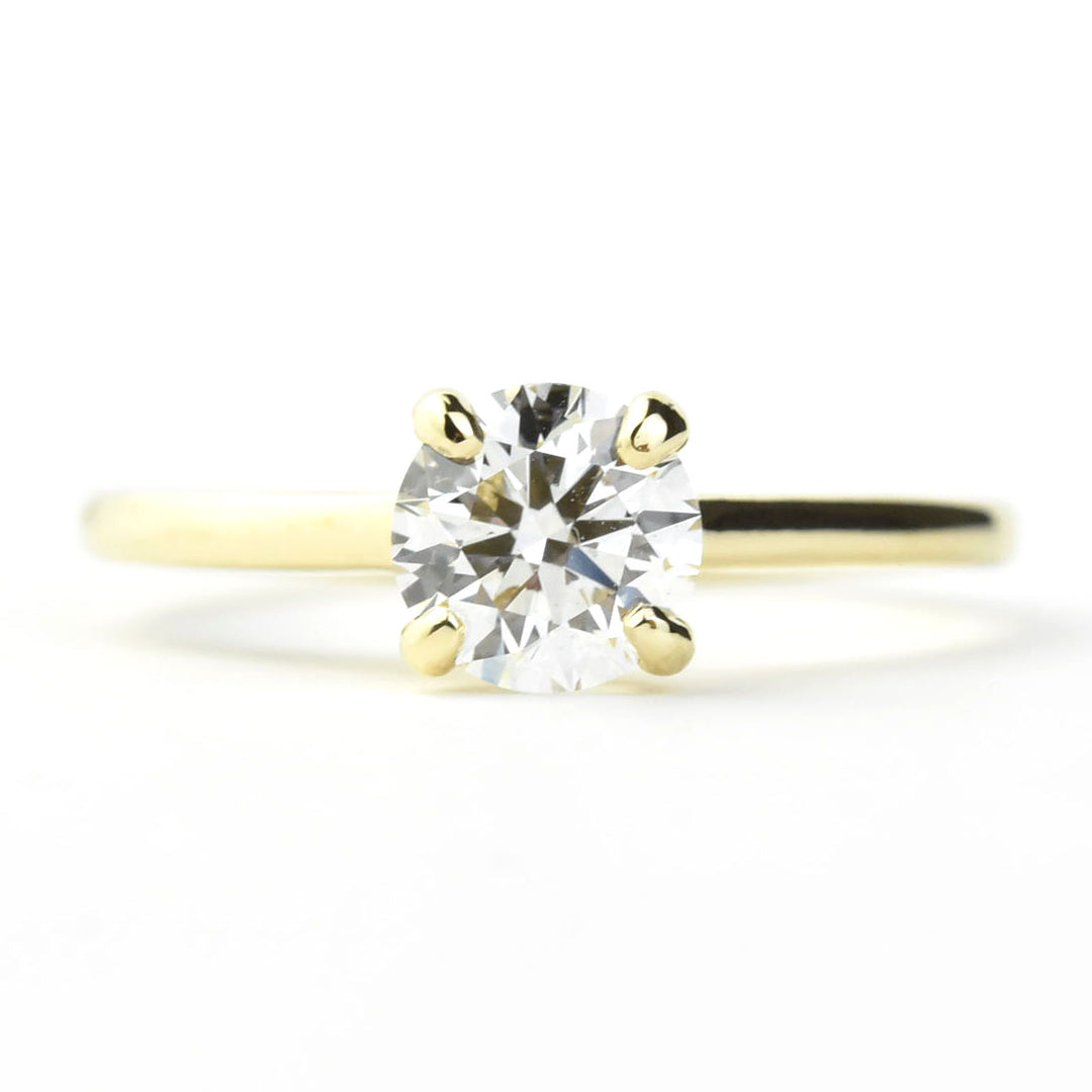 Diamond Solitaire with Cathedral Setting in 14k Gold