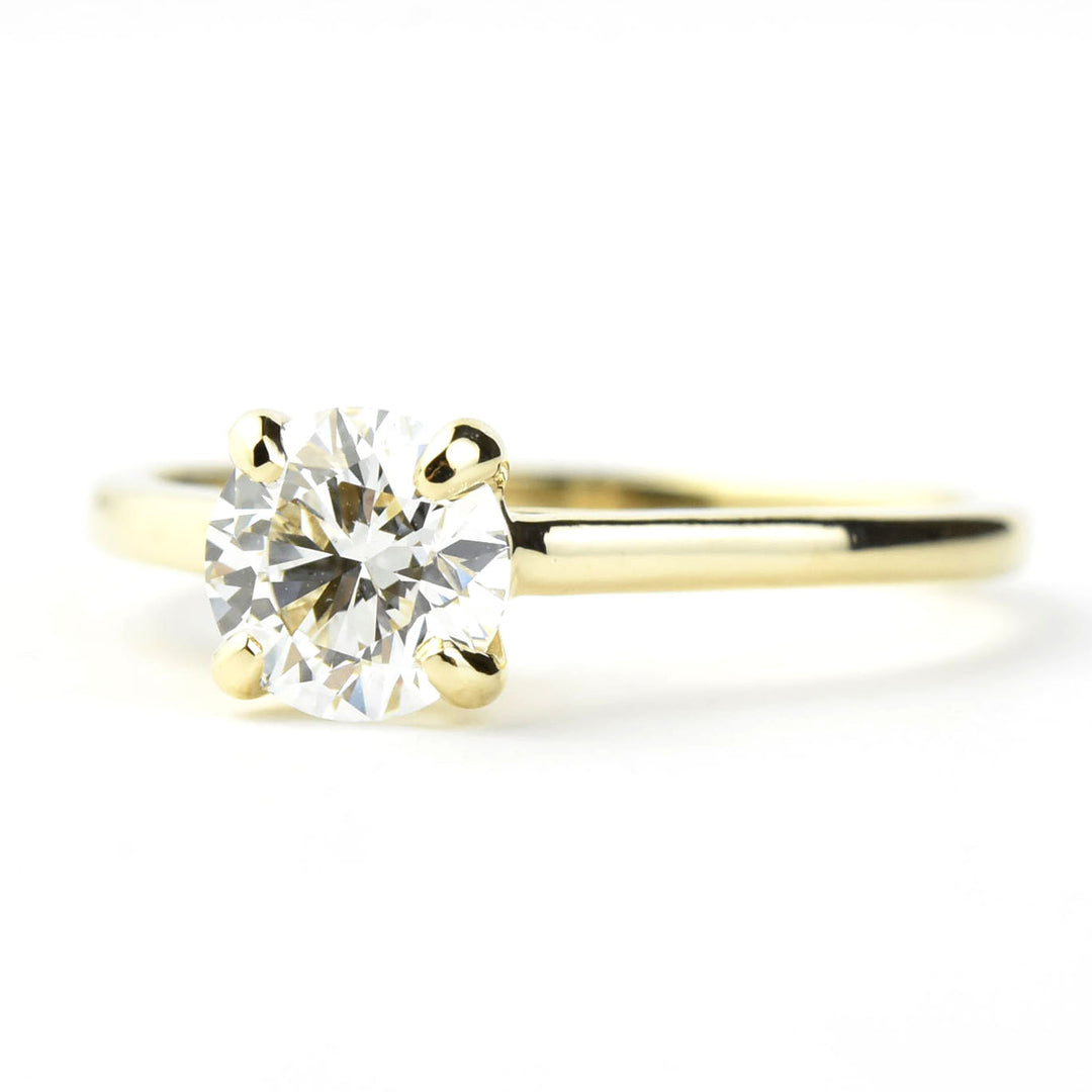 Diamond Solitaire with Cathedral Setting in 14k Gold
