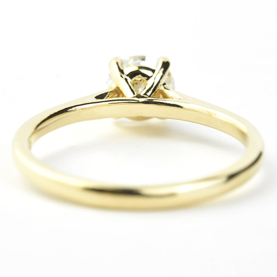 Diamond Solitaire with Cathedral Setting in 14k Gold
