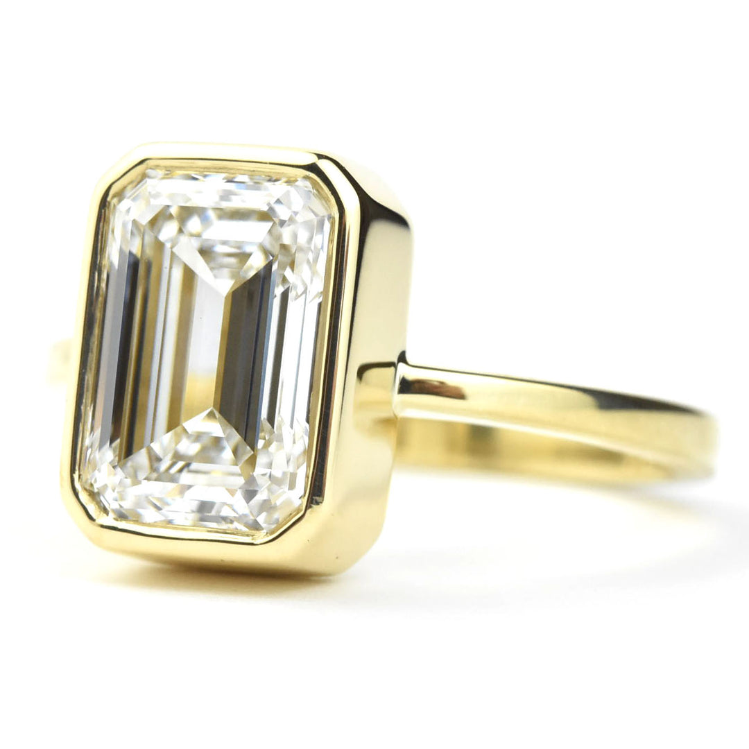 Emerald Cut Diamond Solitaire in Yellow Gold