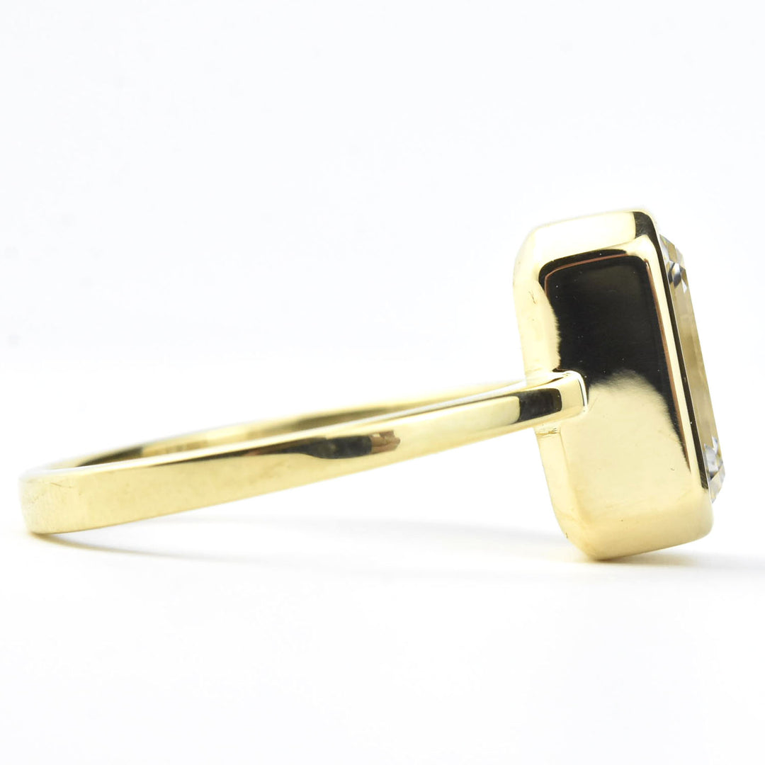 Emerald Cut Diamond Solitaire in Yellow Gold