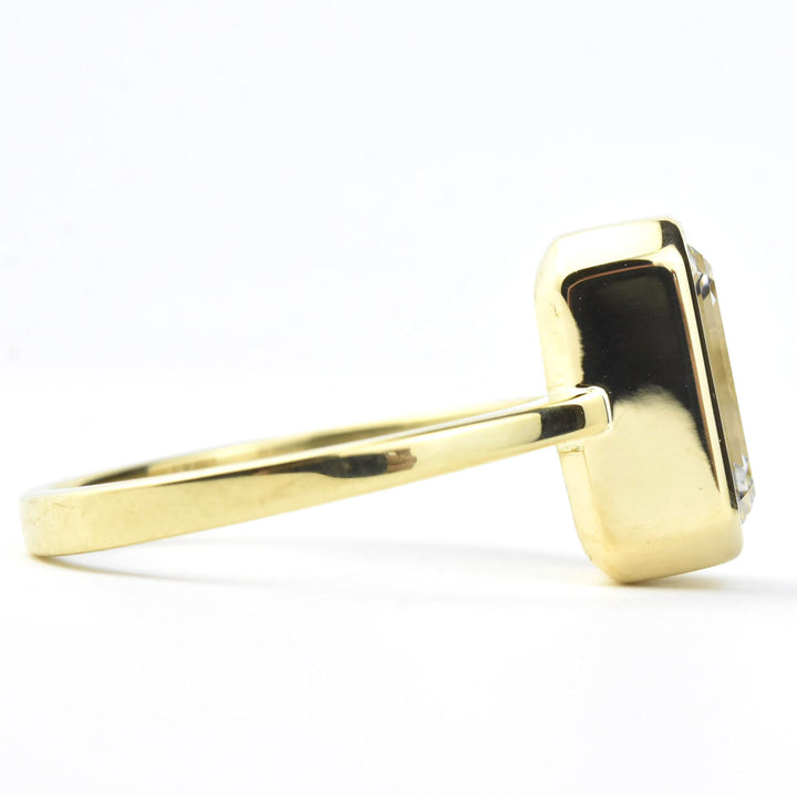 Emerald Cut Diamond Solitaire in Yellow Gold