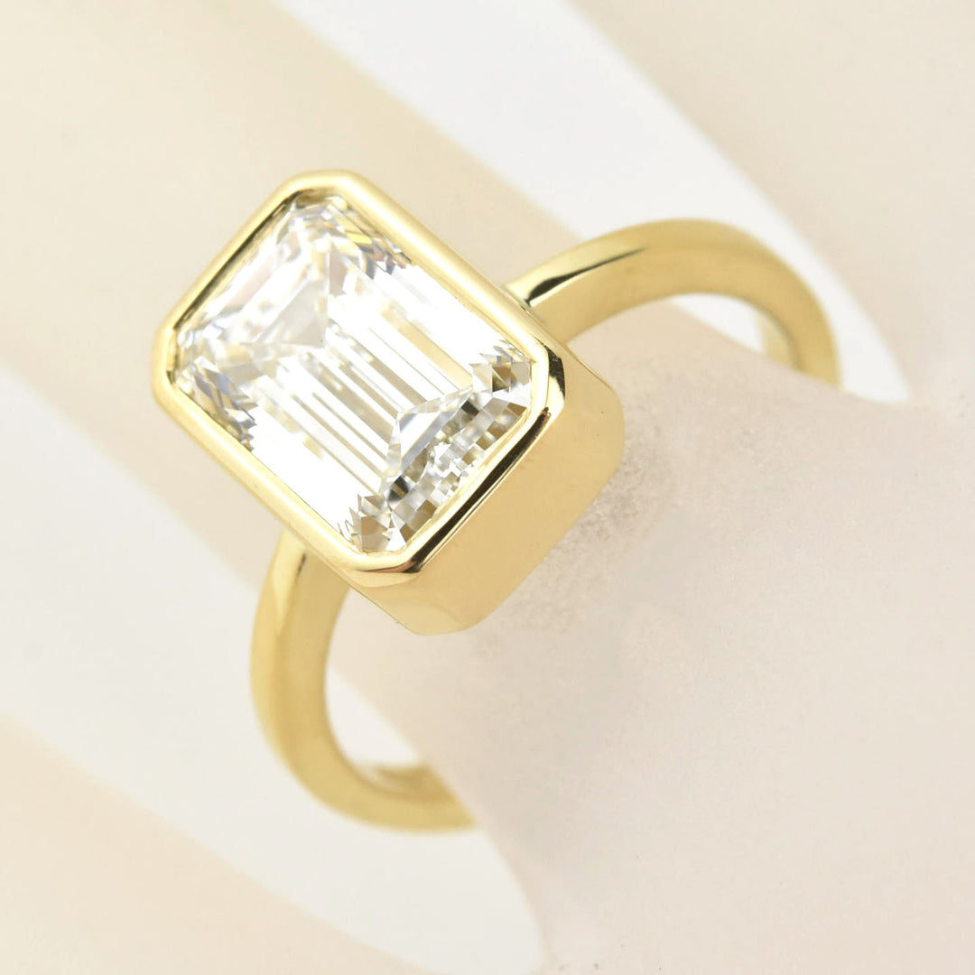 Emerald Cut Diamond Solitaire in Yellow Gold