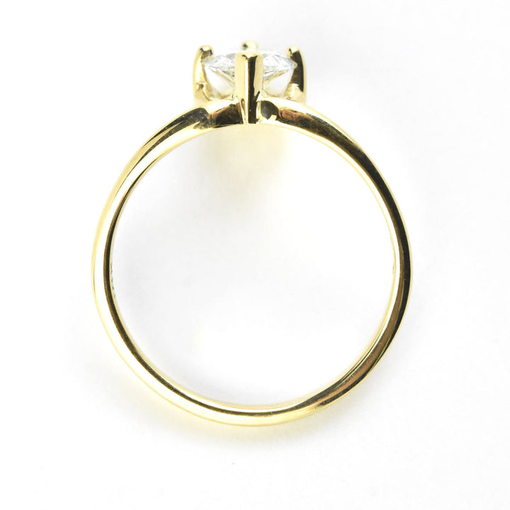 Delicate Pear-Cut Diamond Engagement Ring in 18k Gold