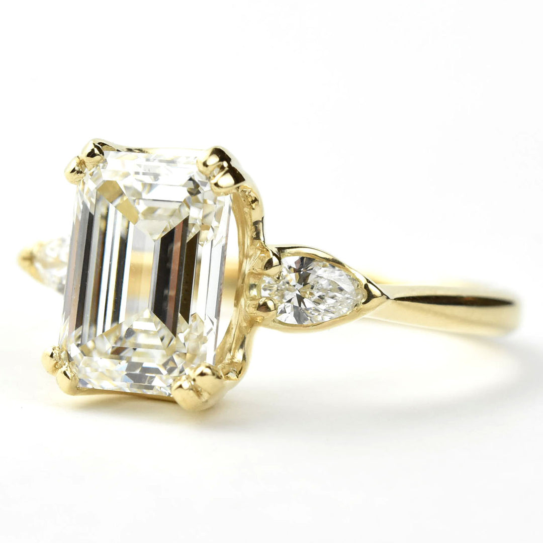 Emerald-cut Diamond Engagement Ring with Pear Accents