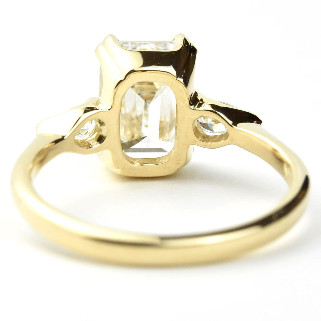 Emerald-cut Diamond Engagement Ring with Pear Accents