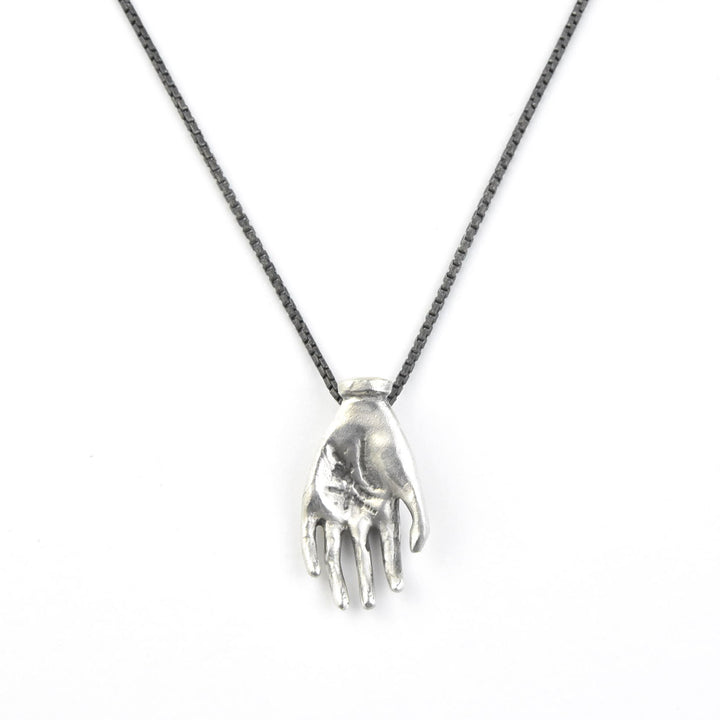 "The Moneymaker" Antiqued Matte Silver Hand Talisman with Ruby - Goldmakers Fine Jewelry