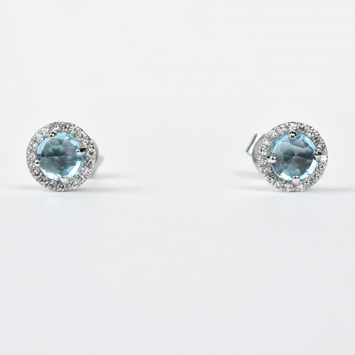 Blue Topaz and Diamond Halo Studs in White Gold - Goldmakers Fine Jewelry